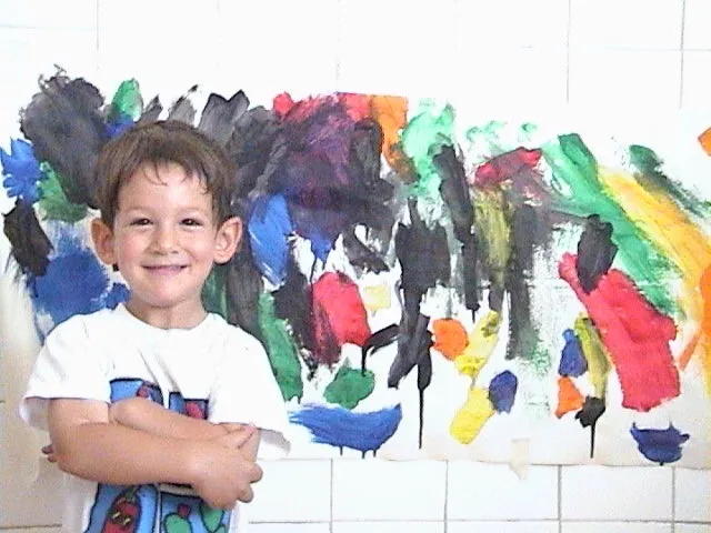 A picture of me as a child with a paintbrush